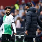 Soccer Football - Premier League - West Ham United v Liverpool - London Stadium, London, Britain - April 27, 2024 Liverpool's Mohamed Salah talks to manager Juergen Klopp after being substituted Action Images via Reuters/John Sibley