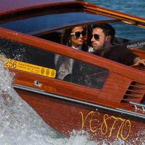 US actor Ben Affleck and US actress and singer Jennifer Lopez travel aboard a vaporetto taxi boat on September 9, 2021 after they arrived to attend the 78th Venice Film Festival in Venice. Filippo MONTEFORTE / AFP