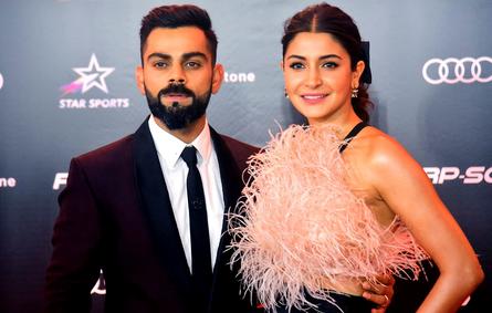 In this photograph taken on September 27, 2019, India's cricketer Virat Kohli with his wife Bollywood actress Anushka Sharma attend the second edition of ‘Indian Sports Honours’ annual ceremony in Mumbai. STR / AFP