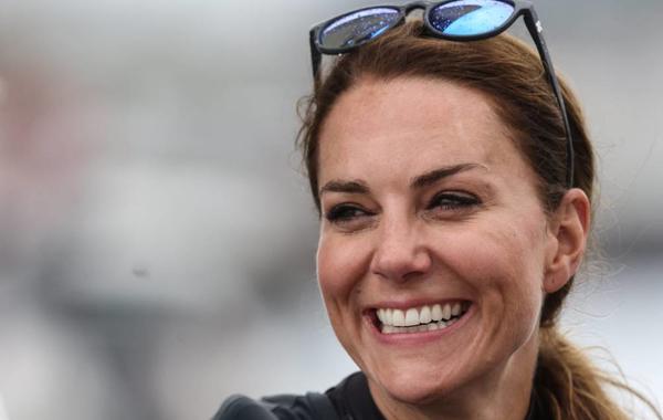Britain's Catherine, Duchess of Cambridge, smiles as she joins the British team aboard of their F50 foiling catamaran to take part in a friendly "Commonwealth Race" against their New Zealand rivals, ahead of the final day of the Great Britain Sail Grand Prix, during a visit in Plymouth, on July 31, 2022. Jeff Gilbert / POOL / AFP