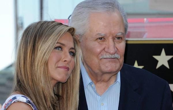 (FILES) In this file photo taken on February 22, 2012, US actress Jennifer Aniston (L) stands for a photo with her father, Greek-US actor John Aniston, during her Hollywood Walk of Fame star ceremony in Hollywood, California. Actor John Aniston, father of US actress Jennifer Aniston, has passed away at the age of 89, according to US media reports. Chris Delmas / AFP