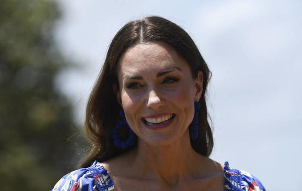 Britain's Catherine, Duchess of Cambridge, smiles upon her arrival with Britain's Prince William, Duke of Cambridge (out of frame), at Hopkins Village, Belize on March 20, 2022. Johan ORDONEZ / AFP