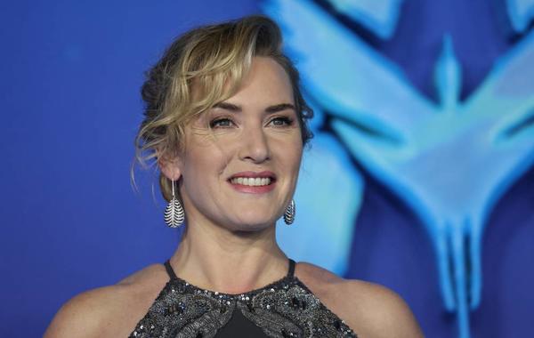 British actress Kate Winslet poses on the red carpet upon arrival for the World Premiere of the film "Avatar: The Way of Water" in London on December 6, 2022. ISABEL INFANTES / AFP