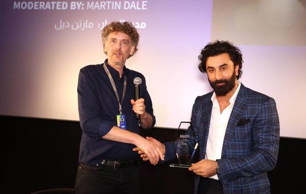 Martin Dale, who moderated an in coversation session with Indian actor Ranbir Kapoor (R), shakes hands with the Bollywood star on the 7th day of the Red Sea International Film Festival, in Jeddah, Saudi Arabia, on December 7, 2022. PATRICK BAZ / Red Sea Film Festival