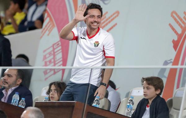 Jordan's Crown Prince Hussein greets the fans during the Group B FIFA World Cup 2022 and the 2023 AFC Asian Cup qualifying football match between Jordan and Australia in the Jordanian capital Amman on November 14, 2019. Ahmad ALAMEEN / AFP