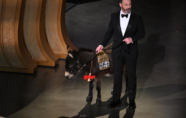 Jimmy Kimmel walks onstage with a donkey during the 95th Annual Academy Awards at the Dolby Theatre in Hollywood, California on March 12, 2023. Patrick T. Fallon / AFP