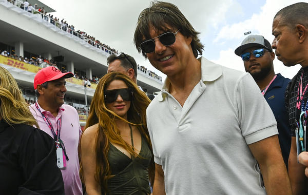 Tom Cruise (R) and Colombian singer Shakira (L) attend the 2023 Miami Formula One Grand Prix at the Miami International Autodrome in Miami Gardens, Florida, on May 7, 2023. (Photo by CHANDAN KHANNA / AFP)